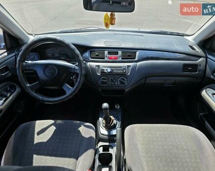 Сірий Міцубісі Lancer, об'ємом двигуна 1.58 л та пробігом 246 тис. км за 4300 $, фото 20 на Automoto.ua