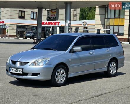 Сірий Міцубісі Lancer, об'ємом двигуна 1.58 л та пробігом 246 тис. км за 4300 $, фото 4 на Automoto.ua
