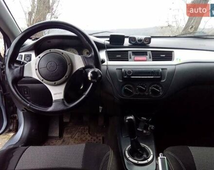 Сірий Міцубісі Lancer, об'ємом двигуна 2 л та пробігом 352 тис. км за 3950 $, фото 12 на Automoto.ua
