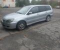 Серый Мицубиси Лансер, объемом двигателя 1.6 л и пробегом 315 тыс. км за 2017 $, фото 1 на Automoto.ua