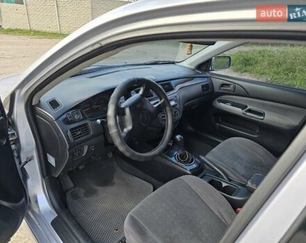 Сірий Міцубісі Lancer, об'ємом двигуна 1.6 л та пробігом 244 тис. км за 4300 $, фото 6 на Automoto.ua