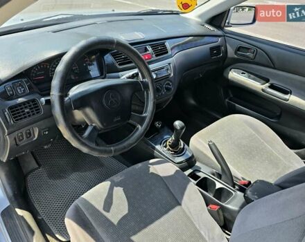 Сірий Міцубісі Lancer, об'ємом двигуна 1.58 л та пробігом 246 тис. км за 4300 $, фото 13 на Automoto.ua