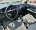 Сірий Міцубісі Lancer, об'ємом двигуна 1.58 л та пробігом 246 тис. км за 4300 $, фото 13 на Automoto.ua