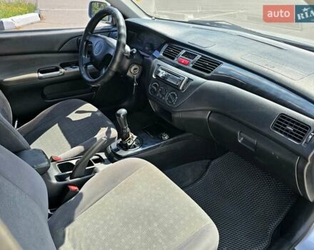 Сірий Міцубісі Lancer, об'ємом двигуна 1.58 л та пробігом 246 тис. км за 4300 $, фото 26 на Automoto.ua