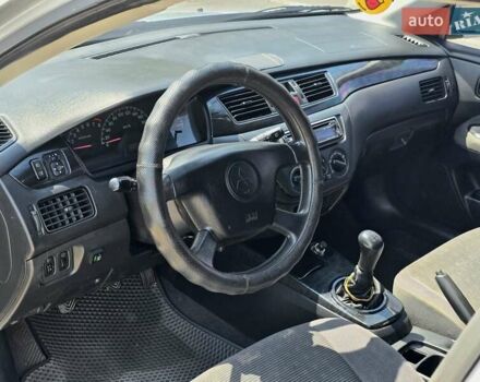 Сірий Міцубісі Lancer, об'ємом двигуна 1.58 л та пробігом 246 тис. км за 4300 $, фото 12 на Automoto.ua
