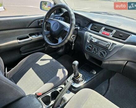 Сірий Міцубісі Lancer, об'ємом двигуна 1.58 л та пробігом 246 тис. км за 4300 $, фото 25 на Automoto.ua