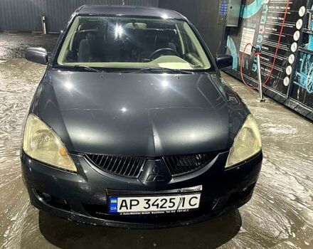 Серый Мицубиси Лансер, объемом двигателя 1.6 л и пробегом 234 тыс. км за 2500 $, фото 4 на Automoto.ua