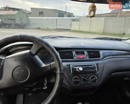 Сірий Міцубісі Lancer, об'ємом двигуна 1.6 л та пробігом 244 тис. км за 4300 $, фото 7 на Automoto.ua