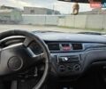 Сірий Міцубісі Lancer, об'ємом двигуна 1.6 л та пробігом 244 тис. км за 4300 $, фото 7 на Automoto.ua
