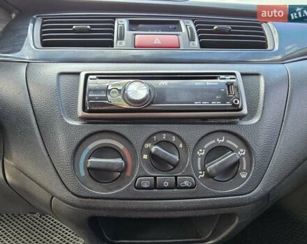 Сірий Міцубісі Lancer, об'ємом двигуна 1.6 л та пробігом 244 тис. км за 4300 $, фото 11 на Automoto.ua
