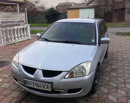 Серый Мицубиси Лансер, объемом двигателя 1.58 л и пробегом 240 тыс. км за 3500 $, фото 2 на Automoto.ua