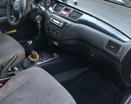 Серый Мицубиси Лансер, объемом двигателя 1.58 л и пробегом 240 тыс. км за 3500 $, фото 4 на Automoto.ua