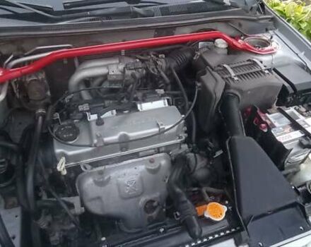 Серый Мицубиси Лансер, объемом двигателя 1.58 л и пробегом 231 тыс. км за 4500 $, фото 11 на Automoto.ua