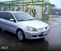 Серый Мицубиси Лансер, объемом двигателя 1.6 л и пробегом 213 тыс. км за 4500 $, фото 4 на Automoto.ua