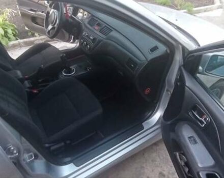 Серый Мицубиси Лансер, объемом двигателя 1.58 л и пробегом 231 тыс. км за 4500 $, фото 1 на Automoto.ua