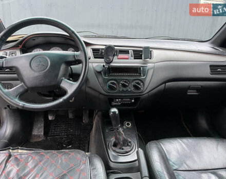 Серый Мицубиси Лансер, объемом двигателя 1.6 л и пробегом 667 тыс. км за 2999 $, фото 6 на Automoto.ua