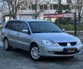 Серый Мицубиси Лансер, объемом двигателя 1.6 л и пробегом 220 тыс. км за 3999 $, фото 5 на Automoto.ua