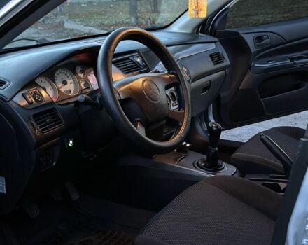 Серый Мицубиси Лансер, объемом двигателя 1.6 л и пробегом 220 тыс. км за 3999 $, фото 6 на Automoto.ua