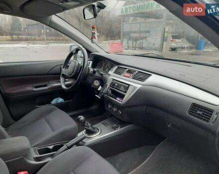 Серый Мицубиси Лансер, объемом двигателя 2 л и пробегом 209 тыс. км за 5800 $, фото 6 на Automoto.ua