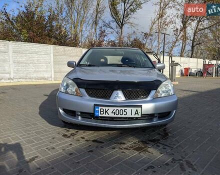 Сірий Міцубісі Lancer, об'ємом двигуна 1.58 л та пробігом 220 тис. км за 4499 $, фото 1 на Automoto.ua