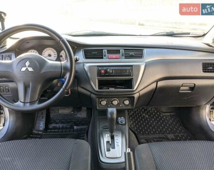 Сірий Міцубісі Lancer, об'ємом двигуна 1.58 л та пробігом 220 тис. км за 4499 $, фото 28 на Automoto.ua