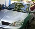 Сірий Міцубісі Lancer, об'ємом двигуна 1.6 л та пробігом 186 тис. км за 4200 $, фото 1 на Automoto.ua