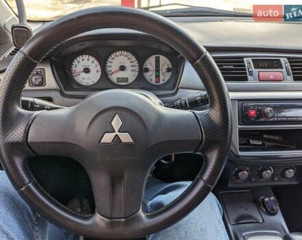 Сірий Міцубісі Lancer, об'ємом двигуна 1.58 л та пробігом 220 тис. км за 4499 $, фото 26 на Automoto.ua