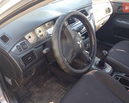 Серый Мицубиси Лансер, объемом двигателя 1.58 л и пробегом 296 тыс. км за 3850 $, фото 3 на Automoto.ua