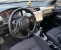 Серый Мицубиси Лансер, объемом двигателя 2 л и пробегом 338 тыс. км за 3700 $, фото 17 на Automoto.ua