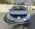 Сірий Міцубісі Lancer, об'ємом двигуна 1.58 л та пробігом 220 тис. км за 4499 $, фото 2 на Automoto.ua