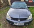 Сірий Міцубісі Lancer, об'ємом двигуна 1.58 л та пробігом 350 тис. км за 3500 $, фото 1 на Automoto.ua