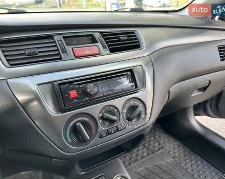 Сірий Міцубісі Lancer, об'ємом двигуна 1.59 л та пробігом 279 тис. км за 4999 $, фото 28 на Automoto.ua