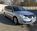 Сірий Міцубісі Lancer, об'ємом двигуна 1.58 л та пробігом 220 тис. км за 4499 $, фото 1 на Automoto.ua