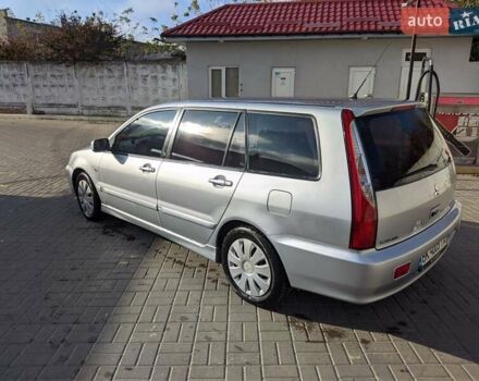 Сірий Міцубісі Lancer, об'ємом двигуна 1.58 л та пробігом 220 тис. км за 4499 $, фото 19 на Automoto.ua