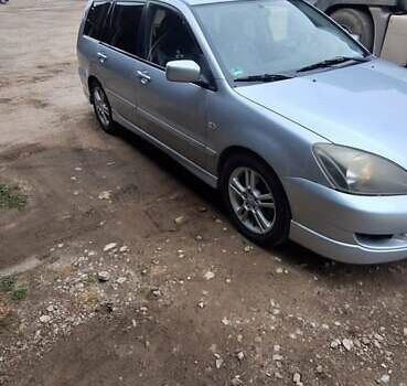 Серый Мицубиси Лансер, объемом двигателя 1.58 л и пробегом 223 тыс. км за 3200 $, фото 6 на Automoto.ua