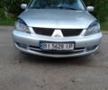 Сірий Міцубісі Lancer, об'ємом двигуна 1.6 л та пробігом 300 тис. км за 3918 $, фото 1 на Automoto.ua