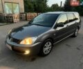 Серый Мицубиси Лансер, объемом двигателя 1.6 л и пробегом 250 тыс. км за 4200 $, фото 1 на Automoto.ua
