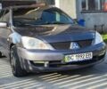 Серый Мицубиси Лансер, объемом двигателя 1.58 л и пробегом 320 тыс. км за 3900 $, фото 1 на Automoto.ua