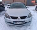 Серый Мицубиси Лансер, объемом двигателя 1.6 л и пробегом 160 тыс. км за 4700 $, фото 1 на Automoto.ua