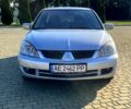 Сірий Міцубісі Lancer, об'ємом двигуна 1.6 л та пробігом 241 тис. км за 4950 $, фото 1 на Automoto.ua