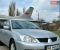 Серый Мицубиси Лансер, объемом двигателя 1.6 л и пробегом 350 тыс. км за 3500 $, фото 1 на Automoto.ua