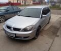 Сірий Міцубісі Lancer, об'ємом двигуна 1.58 л та пробігом 255 тис. км за 3550 $, фото 1 на Automoto.ua