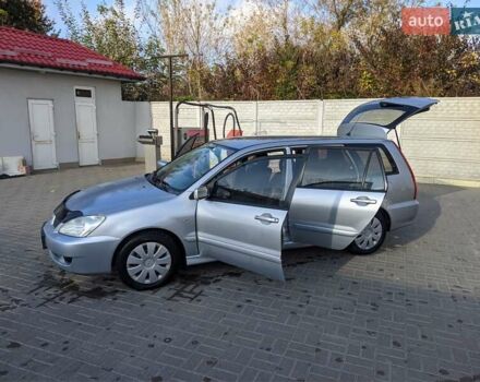 Сірий Міцубісі Lancer, об'ємом двигуна 1.58 л та пробігом 220 тис. км за 4499 $, фото 25 на Automoto.ua