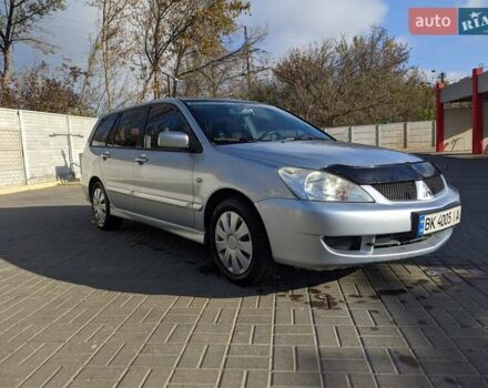 Сірий Міцубісі Lancer, об'ємом двигуна 1.58 л та пробігом 220 тис. км за 4499 $, фото 9 на Automoto.ua