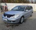 Сірий Міцубісі Lancer, об'ємом двигуна 1.58 л та пробігом 220 тис. км за 4499 $, фото 4 на Automoto.ua