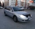 Сірий Міцубісі Lancer, об'ємом двигуна 1.58 л та пробігом 258 тис. км за 2999 $, фото 1 на Automoto.ua