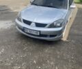 Серый Мицубиси Лансер, объемом двигателя 2 л и пробегом 250 тыс. км за 4058 $, фото 1 на Automoto.ua