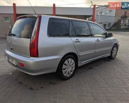 Сірий Міцубісі Lancer, об'ємом двигуна 1.58 л та пробігом 220 тис. км за 4499 $, фото 15 на Automoto.ua