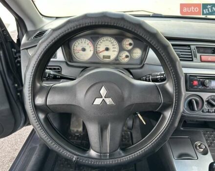 Сірий Міцубісі Lancer, об'ємом двигуна 1.59 л та пробігом 279 тис. км за 4999 $, фото 24 на Automoto.ua