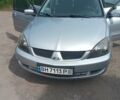 Сірий Міцубісі Lancer, об'ємом двигуна 1.6 л та пробігом 240 тис. км за 5000 $, фото 1 на Automoto.ua